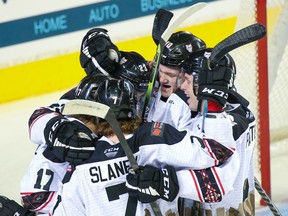 The Calgary Hitmen celebrate forward Steel Quiring’s goal against the Swift Current Broncos at the Scotiabank Saddledome on Sunday, April 3, 2022.