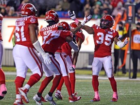 Calgary Stampeders running back Ka’Deem Carey (35) celebrates a touchdown against the Saskatchewan Roughriders with teammates at McMahon Stadium in Calgary on Oct. 23, 2021.