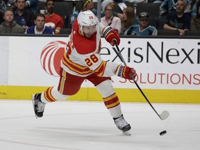 Calgary Flames centre Elias Lindholm, pictured firing a goal-scoring shot against the San Jose Sharks on April 7, 2022, has reached the 40-goal mark this season. His previous career-best was 29.