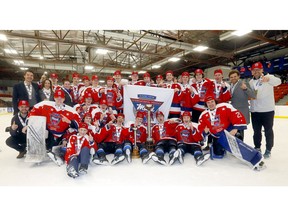 Members of the South Alberta Hockey Academy celebrate after winning the Mac’s International Hockey Tournament championship at the Max Bell Centre in Calgary on Sunday, April 10, 2022.