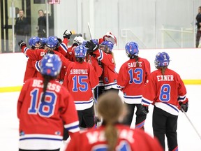 The Calgary RATH celebrate their semifinal win over the Cambridge Turbos during the Canadian Ringette Championships at the 7 Chiefs Sportsplex & Jim Starlight Centre on Tsuut’ina Nation on Friday, April 8, 2022.