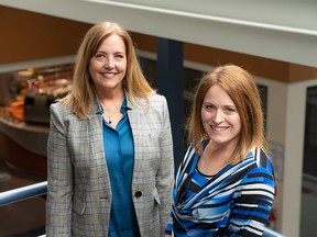 Stem Innovation Academy co-founders Lisa Davis, left, and Sarah Bieber pose for a photo at the new Calgary high school’s new location on Tuesday, May 10, 2022.