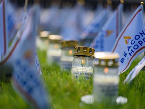 Candles were placed along the Field of Crosses to honour the Calgary Police Services during the Beacons of Hope event on Saturday, May 14, 2022.