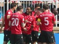 Cavalry FC’s Ali Musse (centre) celebrates a goal with teammates during a 2-0 win over Pacific FC in CPL action on ATCO Field at Spruce Meadows on May 1, 2022.