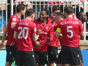 Cavalry FC’s Ali Musse celebrates a goal against Pacific FC with teammates on ATCO Field at Spruce Meadows on Sunday, May 1, 2022.