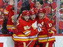 Calgary Flames Blake Coleman, Andrew Mangiapane and Mikael Backlund celebrate Mangiapane's goal on Dallas Stars goaltender Jake Oettinger during game 5 of Stanley Cup playoff action in Calgary on Wednesday, May 11, 2022.