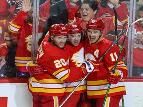 Calgary Flames Blake Coleman, Andrew Mangiapane and Mikael Backlund celebrate Mangiapane’s goal on Dallas Stars goaltender Jake Oettinger during game 5 of Stanley Cup playoff action in Calgary on Wednesday, May 11, 2022.