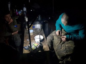 Service members of Mariupol's unit of the Ukrainian Sea Guard stay inside a bunker of the Azovstal Iron and Steel Works, amid Russia's invasion of Ukraine, in Mariupol, Ukraine in this handout picture released on May 15, 2022.