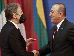 Antony Blinken, U.S. Secretary of State (left), welcomes Mevlut Cavusoglu, Foreign Minister of Turkey, at the beginning of an informal meeting of NATO members states foreign ministers in Berlin, Germany, Sunday, May 15, 2022.