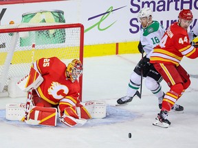 Calgary Flames goaltender Jacob Markstrom keeps an eye on a bouncing puck in Game 2 of their Stanley Cup playoff run against the Dallas Stars at the Scotiabank Saddledome on Thursday, May 5, 2022.