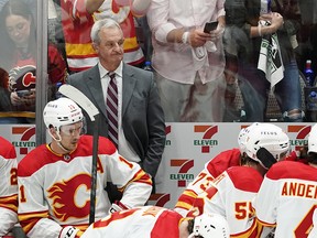 Calgary Flames coach Darryl Sutter watches play in the closing minutes of Game 3 of the team's NHL hockey Stanley Cup first-round playoff series against the Dallas Stars, Saturday, May 7, 2022, in Dallas.