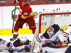 Calgary Flames Matthew Tkachuk battles Edmonton Oilers goalie Mike Smith in first period action during round two of the Stanley Cup Playoffs at the Scotiabank Saddledome in Calgary on Thursday, May 26, 2022.