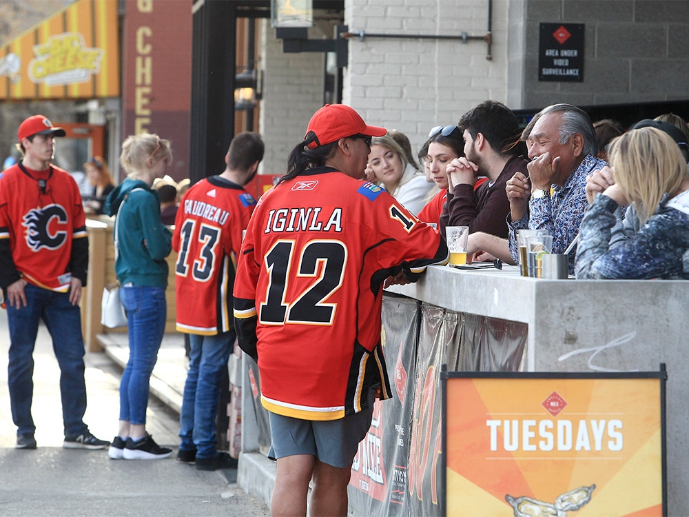 Flames fans celebrate on the Red Mile before puck drops for Game 1 against the Dallas Stars.  May 3, 2022. 