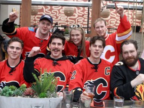 A large group of Flames Fans cheer at The Bench as Flames fan celebrate on the Red Mile before puck drops for Game 1 against the Dallas Stars.  May 3, 2022.