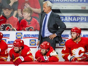 Calgary Flames head coach Darryl Sutter on his bench against the Edmonton Oilers during the third period in Game 1 of the second round of the 2022 Stanley Cup Playoffs at Scotiabank Saddledome on May 18, 2022.