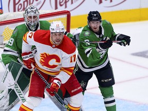 Dallas Stars goaltender Jake Oettinger (29) and defenceman John Klingberg (3) defend against Calgary Flames left wing Milan Lucic (17) during the first period in Game 4 of the first round of the 2022 Stanley Cup Playoffs at American Airlines Center.