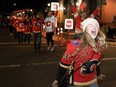 Fans celebrate along the Red Mile after the Calgary Flames beat the Edmonton Oilers 9-6 in Game 1 of the second round of the Stanley Cup Playoffs. Wednesday.