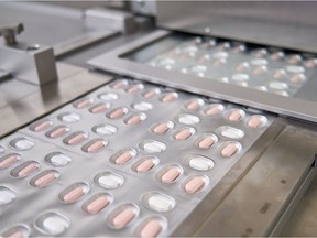 This handout file photo provided on Nov. 16, 2021, courtesy of Pfizer, shows the making of its experimental COVID-19 antiviral pills, Paxlovid, in Freiburg, Germany.