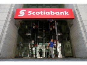 A woman leaves a Bank of Nova Scotia (Scotiabank) branch in Ottawa, Ontario, Canada, May 31, 2016.