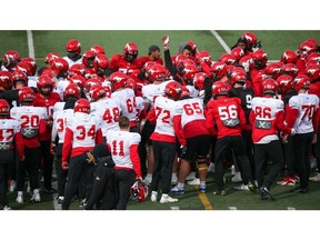 Calgary Stampeders players gather before a training camp practise at McMahon Stadium on Thursday, May 19, 2022.