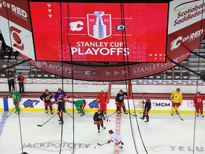 The Calgary Flames practice beneath Stanley Cup logos at Scotiabank Saddledome on Monday, May 2, 2022. The team heads into the first round of the Stanley Cup playoffs against the Dallas Stars on Tuesday.