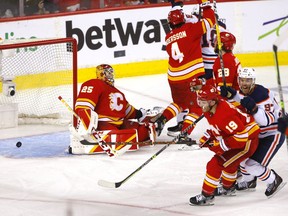 Edmonton Oilers forward Connor McDavid scores on Calgary Flames goalie Jacob Markstrom in overtime to win Game 5 and clinch the second-round playoff series, at Scotiabank Saddledome in Calgary on Thursday, May 26, 2022.