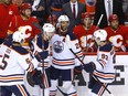 Cody Ceci, Zach Hyman, Darnell Nurse and Ryan Nugent-Hopkins celebrate Hyman’s game-winning goal during Game 2 of their second-round playoff series at Scotiabank Saddledome in Calgary on Friday, May 20, 2022.