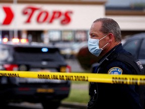 Police officers secure the scene after a shooting at TOPS supermarket in Buffalo, New York, U.S. May 14, 2022.