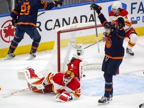 Edmonton Oilers forward Leon Draisaitl (right) celebrates a goal by Evander Kane on Calgary Flames goaltender Jacob Markstrom during Game 3 of their second-round playoff series at Rogers Place in Edmonton on Sunday, May 22, 2022.