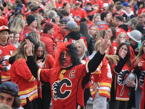 Flames fans celebrate at the Red Lot viewing party ahead of Game 6 between the Calgary Flames at Dallas Stars on Friday.