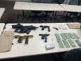 Handguns, ammunition, cocaine and cash seized by Strathmore RCMP following an investigation of a May 5 break-in at a gun shop in Dunmore, near Medicine Hat.