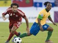 Canada’s Dwayne De Rosario gets past St. Vincent and the Grenadines’ Kendal Velox during a World Cup qualifying match in Montreal in 2008.