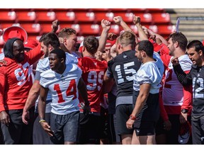The Calgary Stampeders gather during practice at McMahon Stadium on Wednesday. The team kicks off the 2022 CFL regular season on Thursday against the Montreal Alouettes.