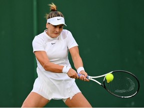Bianca Andreescu of Canada plays a backhand against Emina Bektas of The United States during their Women's Singles First Round Match on day two of The Championships Wimbledon 2022 at All England Lawn Tennis and Croquet Club on June 28, 2022 in London, England.