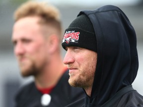 Calgary Stampeders quarterbacks Bo Levi Mitchell (right) and Tommy Stevens look on during practice at McMahon Stadium in Calgary on Friday, June 24, 2022.