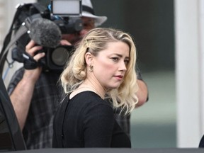 US actress Amber Heard arrives to hear the verdict in the Depp v. Heard trial at the Fairfax County Circuit Courthouse in Fairfax, Virginia, on June 1, 2022.