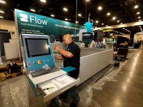 James Zaragoza from Flow Shape Technologies Group sets up for the Global Energy Show at the BMO Centre.