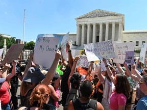Demonstrators gather in front of the U.S. Supreme Court in Washington, D.C., on June 25, 2022, a day after the Supreme Court released a decision on Dobbs v Jackson Women's Health Organization, striking down the right to abortion.