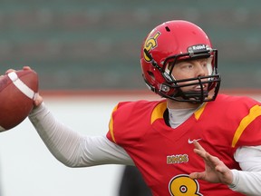 University of Calgary Dinos quarterback Andrew Buckley gets set for a pass against the UBC Thunderbirds in this photo from Nov. 14, 2015.