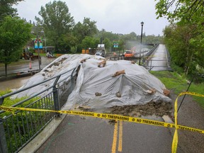 City of Calgary crews built an earth berm across Memorial Drive as flood protection on Tuesday.