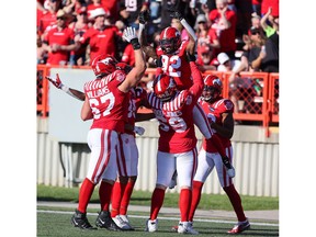 The Calgary Stampeders celebrate receiver Malik Henry's second half touchdown against the Edmonton Elks at McMahon Stadium in Calgary on Saturday, June 25, 2022. The Stampeders won 30-23.