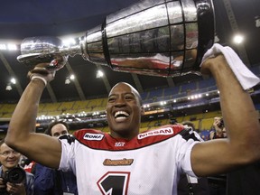 Calgary Stampeders quarterback and game MVP Henry Burris holds the Grey Cup after defeating the Montreal Alouettes at Olympic Stadium in Montreal on Nov. 23, 2008.