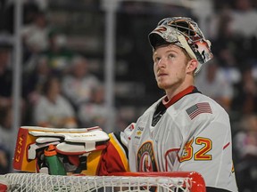 Calgary Flames prospect Dustin Wolf just joined an exclusive club, becoming only the third goaltender in American Hockey League history with three shutouts in a single playoff series.