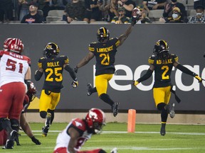 Hamilton Tiger-Cats linebacker Simoni Lawrence celebrates his touchdown against the Calgary Stampeders at Tim Hortons Field in Hamilton on Sept. 17, 2021.