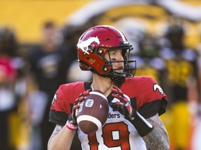 Calgary Stampeders quarterback Bo Levi Mitchell throws the ball against the Tiger-Cats during first-half CFL football action in Hamilton on Saturday night.