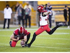 Stampeders place-kicker Rene Paredes boots one of his four field goals against the Tiger-Cats during Saturday’s game in Hamilton.