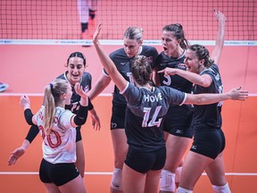 Calgary’s Hilary Howe celebrates with her teammates on the Canadian women’s volleyball squad.