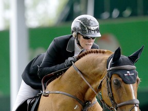 Canada's Beth Underhill rides Chacco Kid during the ATCO Cup at the Spruce Meadows National in Calgary on Friday.