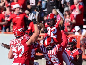 The Stampeders celebrate receiver Malik Henry's second-half touchdown against the Edmonton Elks at McMahon Stadium in Calgary on Saturday.