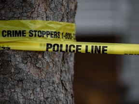 Calgary police tape is seen at the scene of a crime on Friday, April 8, 2022.